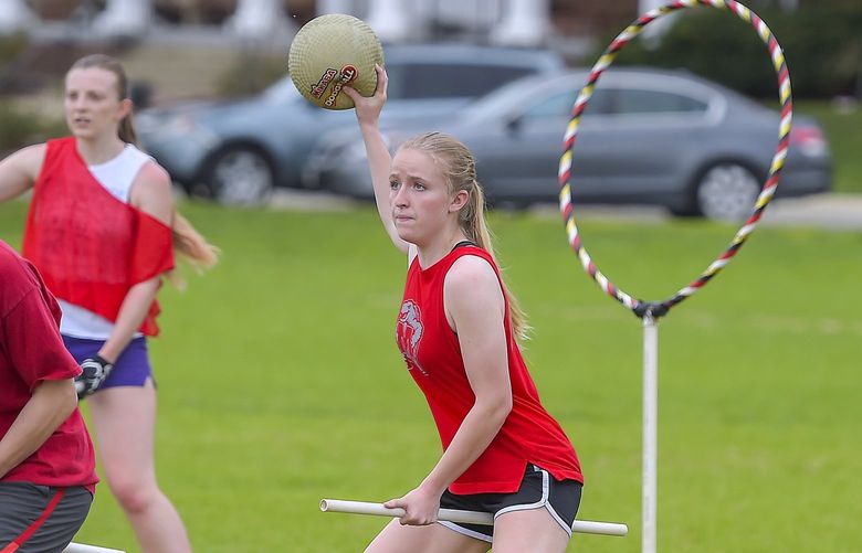 University of Maryland quidditch team member Heather Farnan, center, stands on defense with a bludger during practice in College Park, Md., on April 8, 2019. MUST CREDIT: Photo for The Washington Post by Will Newton.