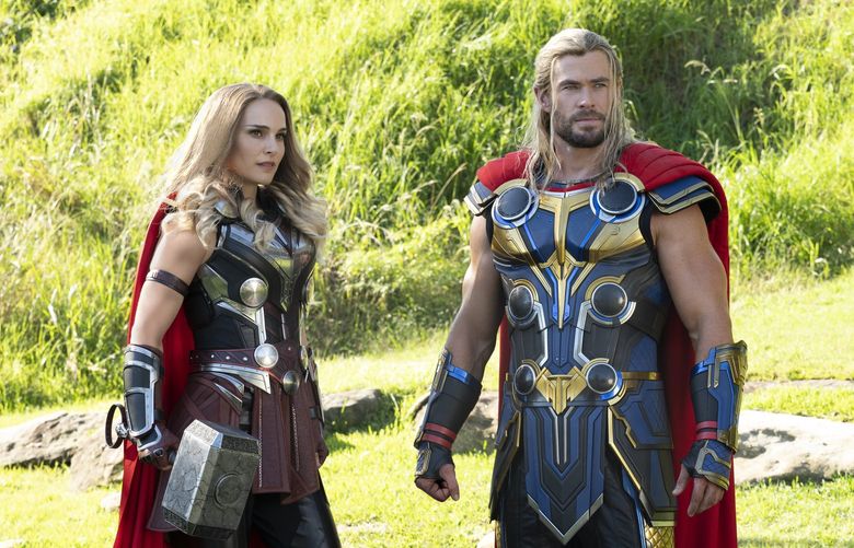 This image released by Marvel Studios shows Natalie Portman, left, and Chris Hemsworth in a scene from “Thor: Love and Thunder.” (Jasin Boland/Marvel Studios-Disney via AP) NYET206 NYET206
