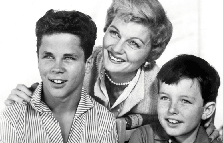 Subject: Barbara Billingsley, Tony Dow (Let), And Jerry Mathers
Program: “Leave It to Beaver”
On Air: Thursdays, 9-9:30 PM, EDT. 
“Beaver” Trio
Barbara Billingsley, who stars as Mrs. Cleaver, poses with television sons Tony Dow (Wally) left, and Jerry Mathers (Beaver) on the set of ABC-TV’s “Leave It to Beaver” Thursdays, 9-9:30 PM, EDT.