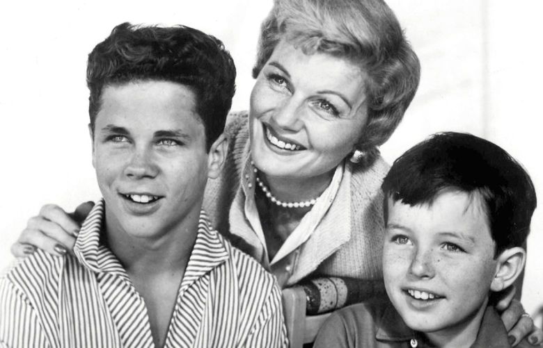 Subject: Barbara Billingsley, Tony Dow (Let), And Jerry Mathers
Program: “Leave It to Beaver”
On Air: Thursdays, 9-9:30 PM, EDT.
“Beaver” Trio
Barbara Billingsley, who stars as Mrs. Cleaver, poses with television sons Tony Dow (Wally) left, and Jerry Mathers (Beaver) on the set of ABC-TV’s “Leave It to Beaver” Thursdays, 9-9:30 PM, EDT.