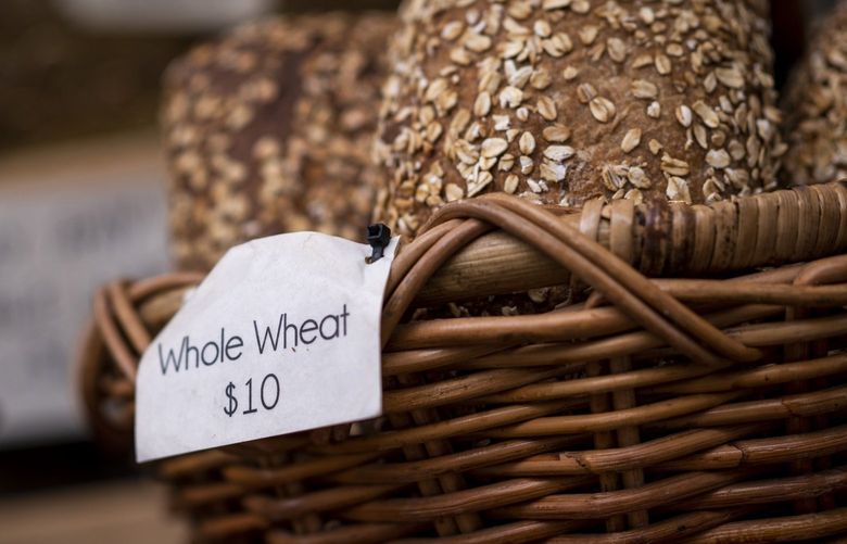 Whole wheat bread for sale at a farmers market in Chicago, Illinois, US, on Saturday, July 16, 2022. Amid the highest US inflation in four decades, bread prices have soared this year, pushing more premium options to an unheard-of $10 a loaf and beyond. Photographer: Christopher Dilts/Bloomberg