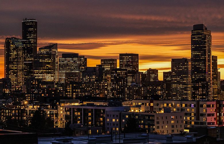 A golden sunset graces the Seattle skyline on Wednesday, Jan 12, 2022. 219321