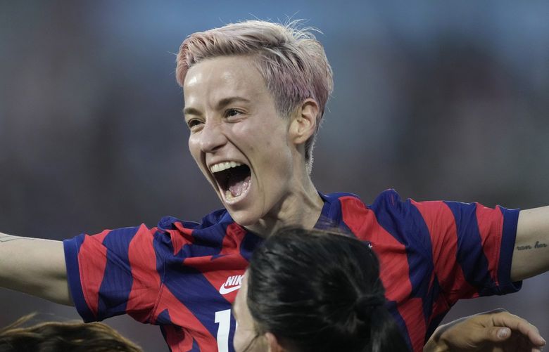 U.S. forward Megan Rapinoe, back, celebrates with midfielder Taylor Kornieck after Kornieck’s goal against Colombia during the second half of an international friendly soccer match Saturday, June 25, 2022, in Commerce City, Colo. (AP Photo/David Zalubowski) CODZ134 CODZ134