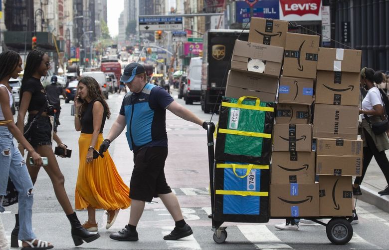 A worker delivers packages on Amazon Prime Day in New York, US, on Tuesday, July 12, 2022.Photographer: Michael Nagle/Bloomberg