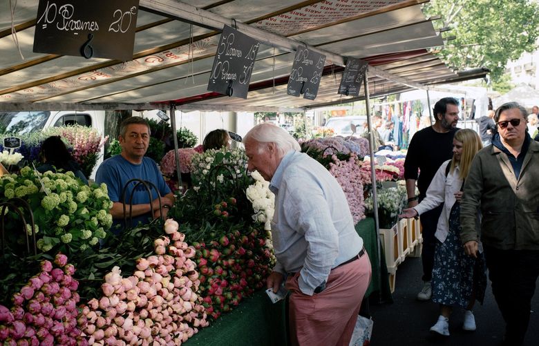 An outdoor market in Paris on May 28. The euro’s slide makes imports more expensive for people and businesses in the 19 countries that use the currency, adding to the region’s inflationary woes. (Dmitry Kostyukov / The New York Times)