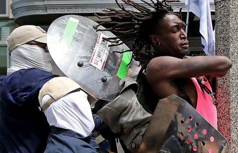 BOSTON, MA – July 2: A fight breaks out as the white supremacist group, The Patriot Front marches thru the city of Boston on July 2, 2022 in , BOSTON, MA. (Staff Photo By Stuart Cahill/MediaNews Group/Boston Herald)