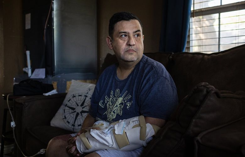 Arnulfo Reyes, a teacher who was wounded in the shooting at Robb Elementary School, at home in Uvalde, Texas, July 9, 2022. “I think about it more and more. What could they have done differently?” Reyes said in an interview recounting the events of May 24, when a mass shooting at the school left 19 students and two teachers dead. (Tamir Kalifa/The New York Times)
