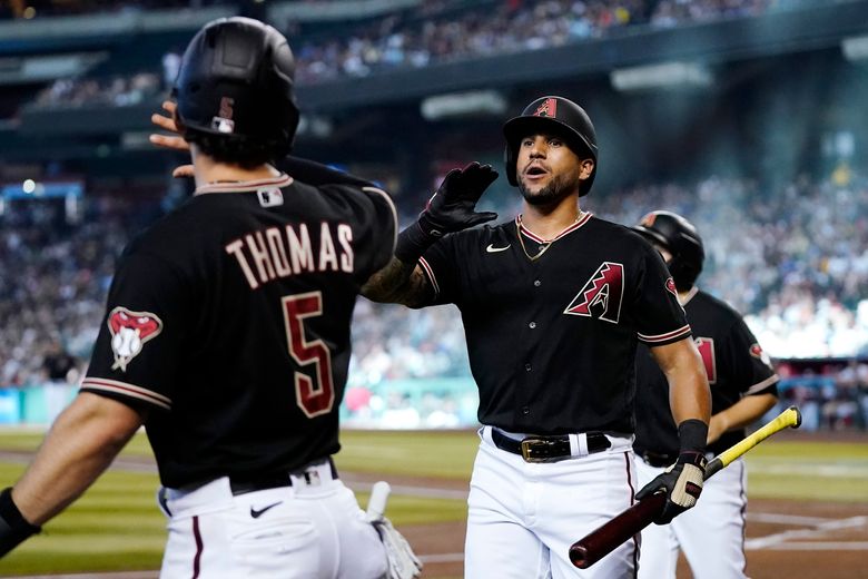 Arizona Diamondbacks first round MLB draft pick Druw Jones throws out the  first pitch prior to a baseball game against the Washington Nationals  Saturday, July 23, 2022, in Phoenix. (AP Photo/Ross D.