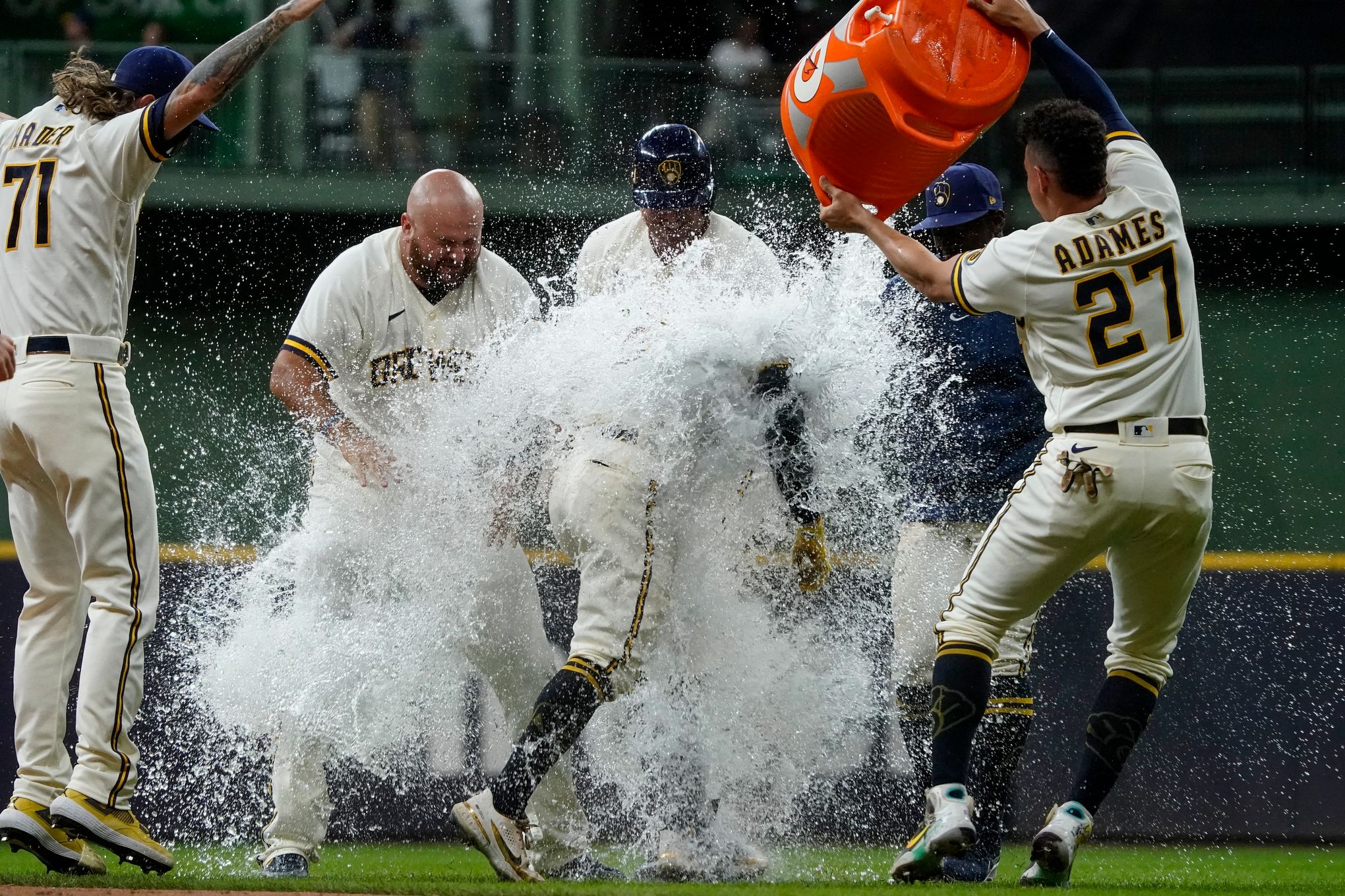 Milwaukee Brewers shortstop Luis Urias throws to first during a