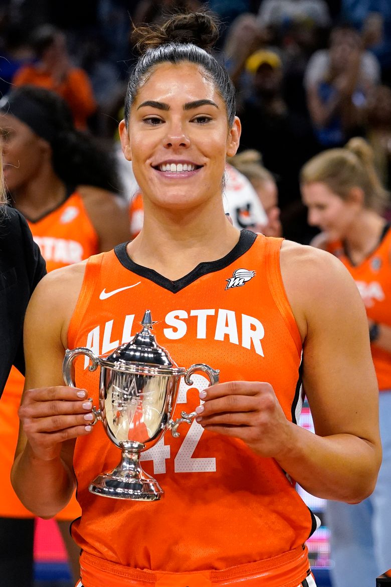 Team Wilson’s Kelsey Plum holds up the MVP trophy after team Wilson defeated Team Stewart in a WNBA All-Star basketball game in Chicago, Sunday, July 10, 2022. (AP Photo/Nam Y. Huh)