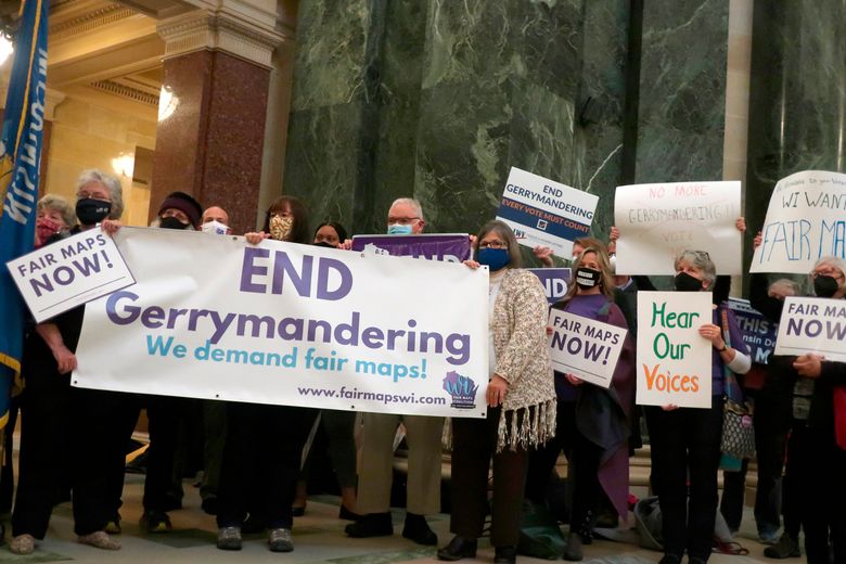 FILE – More than 100 opponents of the Republican redistricting plans vow to fight the maps at a rally ahead of a joint legislative committee hearing at the Wisconsin state Capitol in Madison, Wis., on Thursday, Oct. 28, 2021. In overturning a half-century of nationwide legal protection for abortion, the U.S. Supreme Court ruled that Roe v. Wade had been wrongly decided and that it was time to “return the issue of abortion to the people’s elected representatives” in the states. But some question whether gerrymandering has diminished the ability of state legislatures to truly represent the people’s will. (AP Photo/Scott Bauer, File)