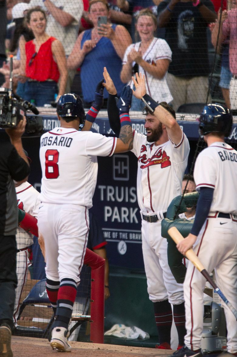 Max Fried of the Atlanta Braves celebrates with Dansby Swanson of