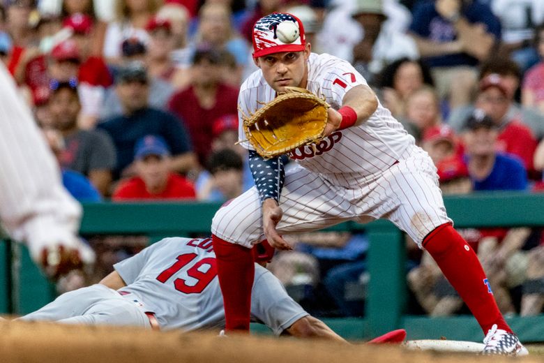 Philadelphia Phillies' Didi Gregorius, left, and Zack Wheeler put