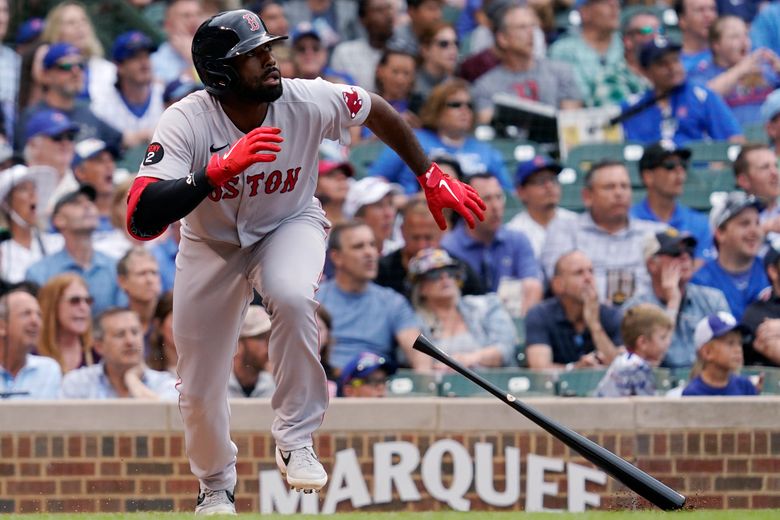 Reds use two three-run innings to beat Cubs