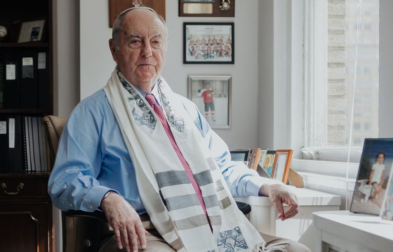 Harry Oxman, 86, who celebrated his bar mitzvah in 2019, wears his tallit at his office in Philadelphia, July 28, 2022. Rituals like graduations and weddings are few and far between for older adults — some are finding ways to honor their momentous occasions. (Michelle Gustafson/The New York Times) XNYT29 XNYT29