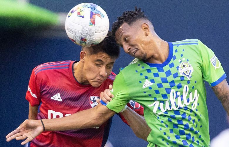 Dallas’ Marco Farfan, left, and Seattle’s Leo Chu bump heads going after the ball near the Seattle goal in the first half of play.

Dallas FC played the Seattle Sounders in Major League Soccer Tuesday, August 2, 2022 at Lumen Field, in Seattle, WA.