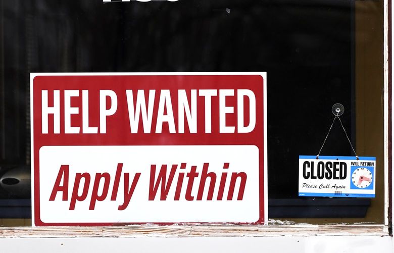 FILE – A “help wanted” sign is seen at an Allstate insurance office in Elgin, Ill., March 19, 2022. (AP Photo/Nam Y. Huh, File) 