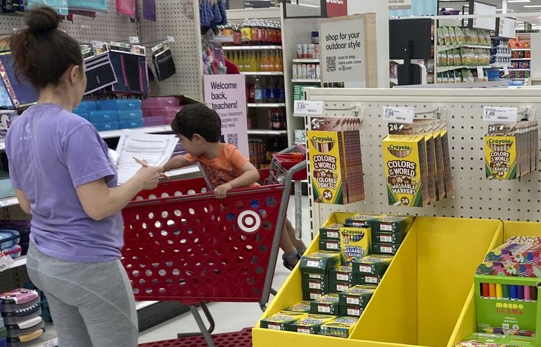 A parent shops for school supplies at a Target store, Wednesday, July 27, 2022, in North Miami, Fla. (AP Photo/Marta Lavandier) FLML104 FLML104