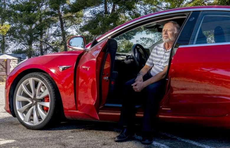 Dennis Levitt in one of his Teslas. Photographer: Kyle Grillot/Bloomberg