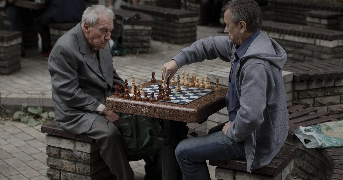 Odessa, Ukraine. 31st Mar, 2022. Elderly men play chess at the