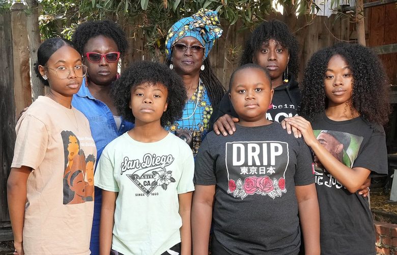 Taiwo Kujichagulia-Seitu with members of her family in Oakland, Calif. on July 25, 2022. Kujichagulia-Seitu is searching for clues that would help to reunite her family, which was torn apart during the domestic slave trade. (Jim Wilson/The New York Times) XNYT54 XNYT54