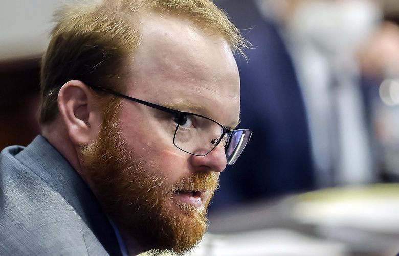 FILE – Travis McMichael looks on during the sentencing in his trial along with his father Greg McMichael and neighbor, William “Roddie” Bryan in the Glynn County Courthouse, on Jan. 7, 2022, in Brunswick, Ga. Months after they were sentenced to life in prison for murder, the three white men who chased and killed Ahmaud Arbery in a Georgia neighborhood faced a second round of criminal penalties Monday, Aug. 8, 2022, for federal hate crimes committed in the deadly pursuit of the 25-year-old Black man. (AP Photo/Stephen B. Morton, Pool, File) NYAB509 NYAB509