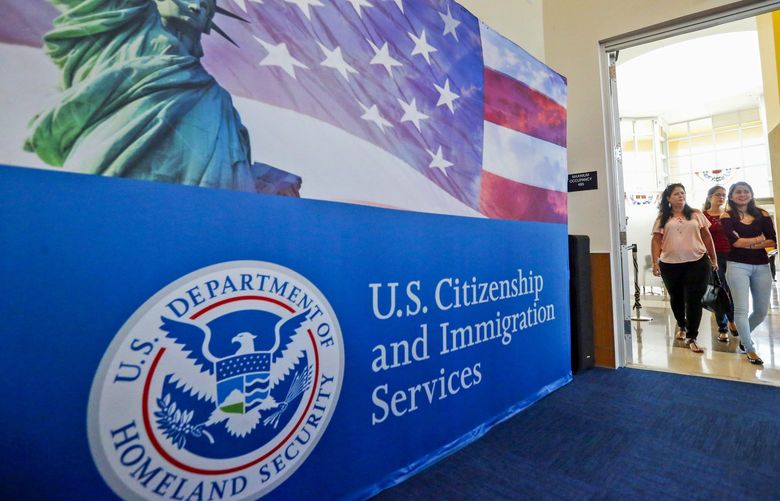 FILE – In this Aug. 17, 2018, file photo, people arrive before the start of a naturalization ceremony at the U.S. Citizenship and Immigration Services Miami Field Office in Miami. USCIS, The cash-strapped federal agency that oversees that nation’s legal immigration system, scrapped plans Tuesday, Aug. 25, 2020, to furlough 13,000 employees, or nearly 70% of its workforce. The agency said it would maintain operations through September when the the fiscal year ends.  (AP Photo/Wilfredo Lee, File) NYDD203