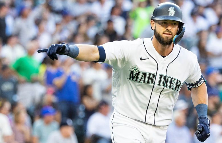 Mitch Haniger points to his teammates after homering in the first inning Monday.

The New York Yankees played the Seattle Mariners in Major League Baseball Monday, August 8, 2022 at T-Mobile Park, in Seattle, WA. 221219