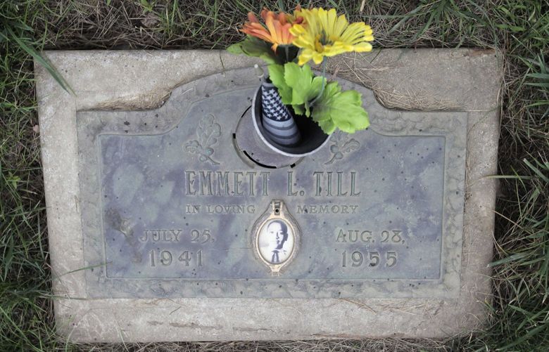 The grave site of lynching victim Emmett Till is seen Friday, July 10, 2009, at the Burr Oak Cemetery in Alsip, Ill., the same cemetery where four workers are accused of digging up bodies to resell plots. While Till’s grave site was not disturbed, Cook County investigators found his original iconic glass-topped casket rusting in a shack at the cemetery. The 14-year-old Chicagoan was killed in 1955 after reportedly whistling at a white woman during a visit to his uncle’s house in Mississippi. Nearly 100,000 people visited his glass-topped casket during a four-day public viewing in Chicago. Images of his battered body helped spark the civil rights movement. When Till was exhumed in 2005 during an investigation of his death, he was reburied in a new casket. The original casket was supposed to be kept for a planned memorial to Till. (AP Photo/M. Spencer Green) CX114