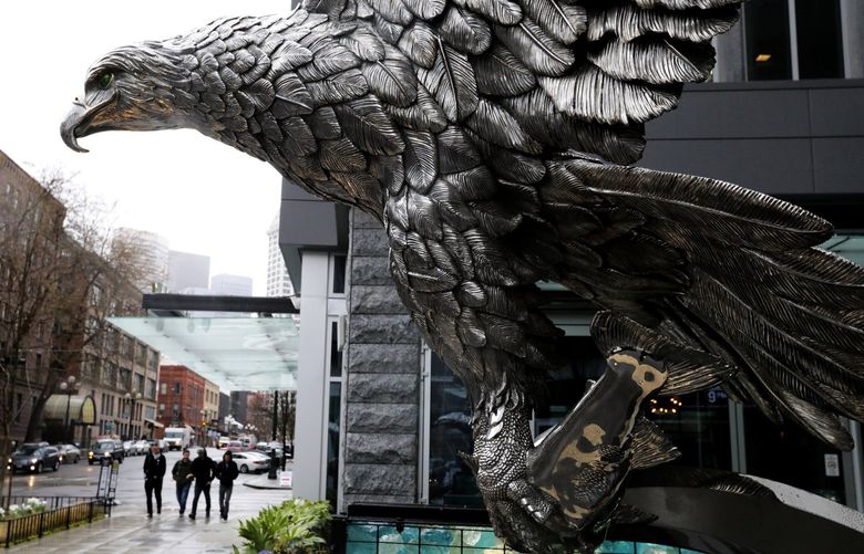 “Splashdown,” Chester Fields’ stainless steel (CQ) eagle sculpture, dominates the entrance to the new Avalara Hawk Tower on South King Street just north of CenturyLink Field in Pioneer Square. In its talons is a trout.
LO Feature
(there is incorrect information online about the piece
the sculpture is not bronze
varying heights are given
but it’s more than a dozen feet tall according to the artist)