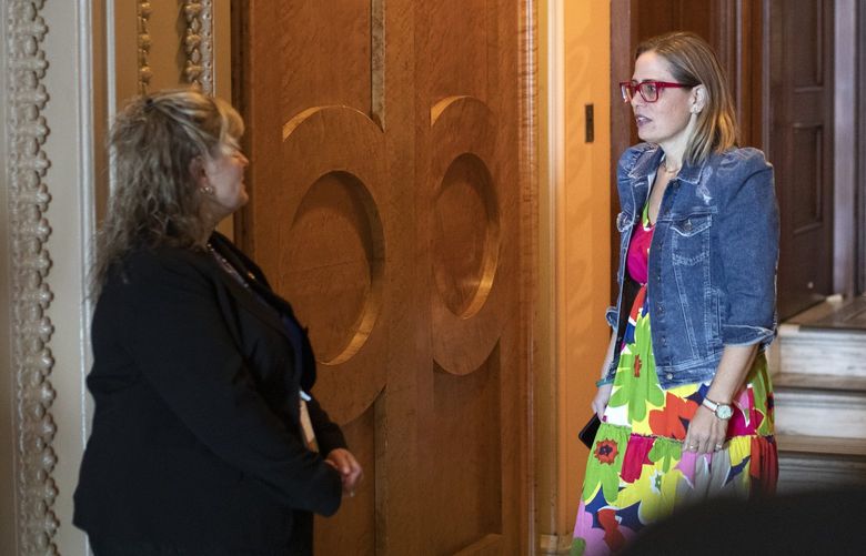 Sen. Kyrsten Sinema (D-Ariz.) exits the Senate chamber during a series of votes on Capitol Hill in Washington, Aug. 7, 2022. A last-minute mobilization of political muscle and direct pleas to Sen. Sinema, who opposes tax increases and is sympathetic to private equity, succeeded in getting the measure to include private investment funds in a 15 percent corporate minimum tax scrapped. (Tom Brenner/The New York Times)