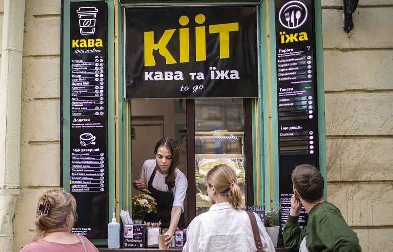Kiit cafe, named after Serhii Stoian’s cat, who went missing in the war, in Lviv, Ukraine on July 27, 2022. Ukrainians forced from their hometowns by Russia’s invasion find some solace, and success, setting up shop in a new city. (Diego Ibarra Sanchez for The New York Times) XNYT80