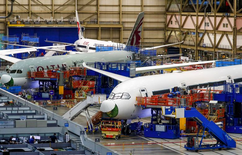 Inside Boeing’s Everett plant in June, mechanics checked for defects in the structural joins on previously built 787 aircraft and performed re-work where needed.