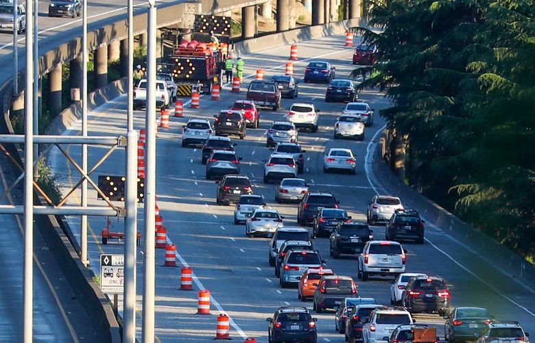 Workers marked off a lane of I-5 before an overnight shift Monday, to grind some pavement before a huge repaving job this weekend — when four southbound lanes close through Sodo. 217464 217464