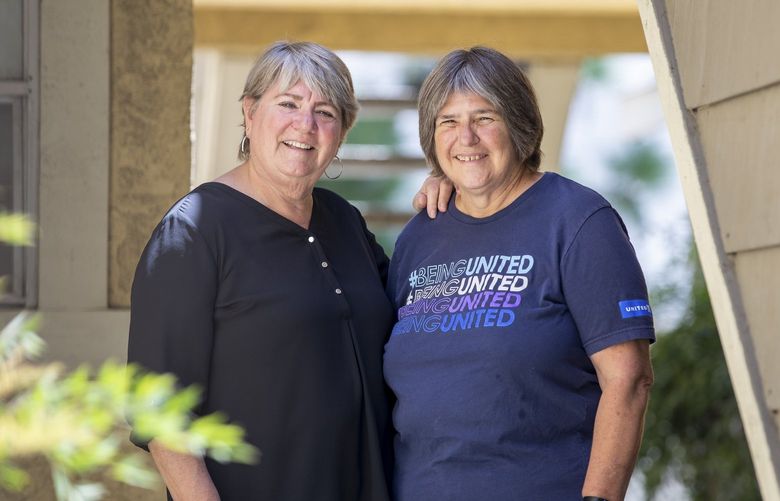 Joey Boyd-Scott, left, and her wife, Maria, who both have part-time travel jobs, in Upland, Calif. on Aug. 5, 2022.  A growing class of auxiliary travel workers are stepping in as airlines and hotels, already struggling with thinned ranks after mass layoffs in 2020, now contend with the great resignation of employees. (Beth Coller/The New York Times) XNYT62 XNYT62