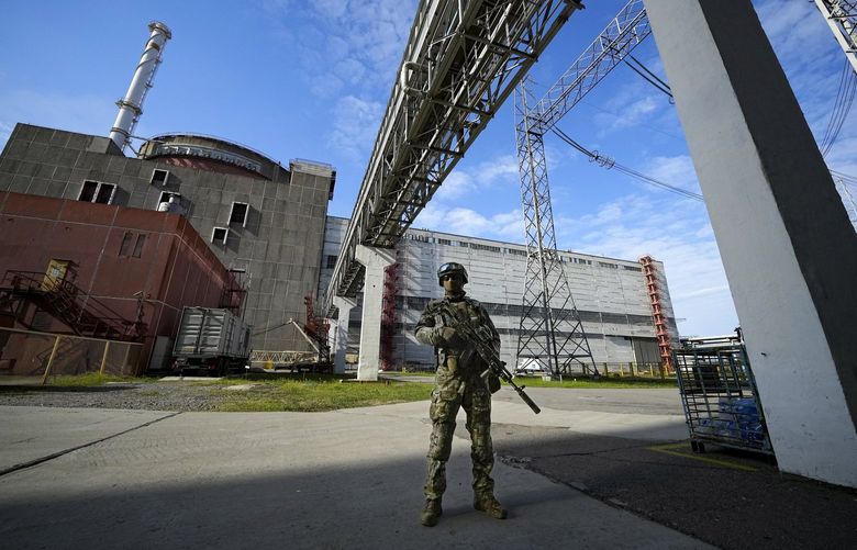 FILE – A Russian serviceman guards in an area of the Zaporizhzhia Nuclear Power Station in territory under Russian military control, southeastern Ukraine, on May 1, 2022. The Zaporizhzhia plant is in southern Ukraine, near the town of Enerhodar on the banks of the Dnieper River. It is one of the 10 biggest nuclear plants in the world. Russia and Ukraine have accused each other of shelling Europe’s largest nuclear power plant, stoking international fears of a catastrophe on the continent.  This photo was taken during a trip organized by the Russian Ministry of Defense. (AP Photo, File) XAZ901 XAZ901