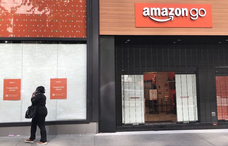 Signs announce that the gated-over Amazon Go store near 4th Avenue and Pike Street in downtown Seattle is “temporarily closed.” The company said there were too many safety problems for its employees, customers and vendors.