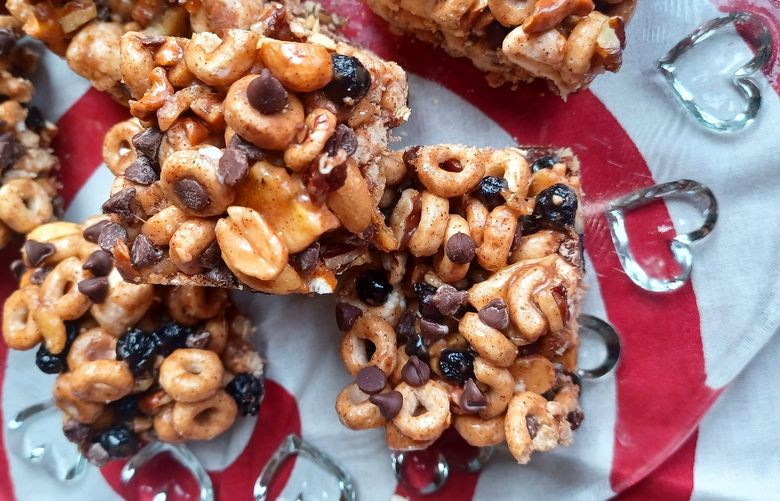 The secret is in the sticky sauce of these no-bake cereal bars: vanilla, almond extract and cinnamon are mixed in to the butter-and-marshmallow coating.