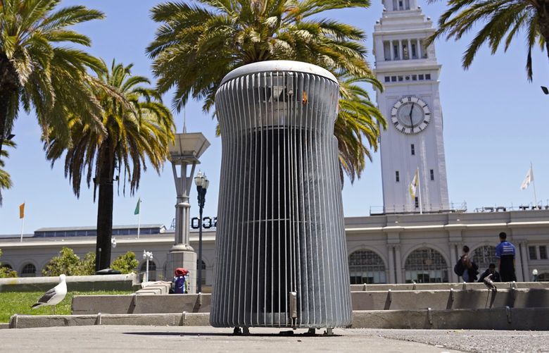 A prototype trash can called Salt and Pepper is seen near the Embarcadero and Ferry Building in San Francisco on July 26, 2022. What takes years to make and costs more than $20,000? A trash can in San Francisco. The pricey, boxy bin is one of three custom-made trash cans the city is testing this summer as part of its yearslong search for another tool to fight its battle against dirty streets. (AP Photo/Eric Risberg) FX805 FX805