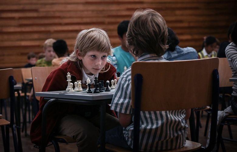 Maksym Kryshtafor, 8, competes in a chess tournament at the Quaker Bootham School in York, England, June 12, 2022. Kryshtafor, a talented chess player and refugee from Ukraine, is using his passion for the game to help him assimilate into the United Kingdom. (Mary Turner/The New York Times) XNYT12 XNYT12