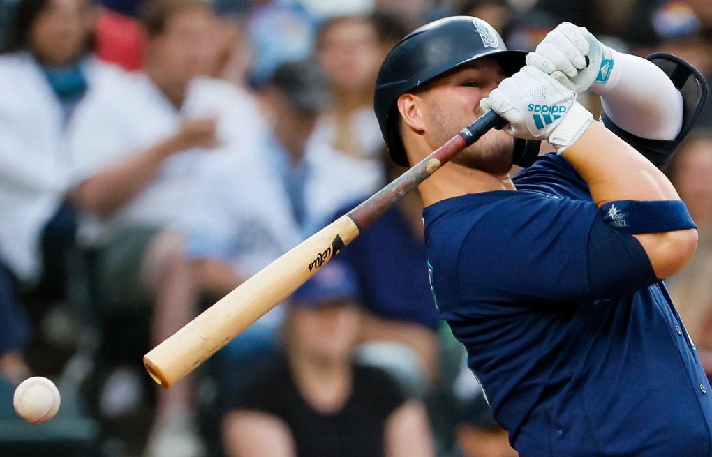 Seattle Mariners' Ty France removes his batting gear after