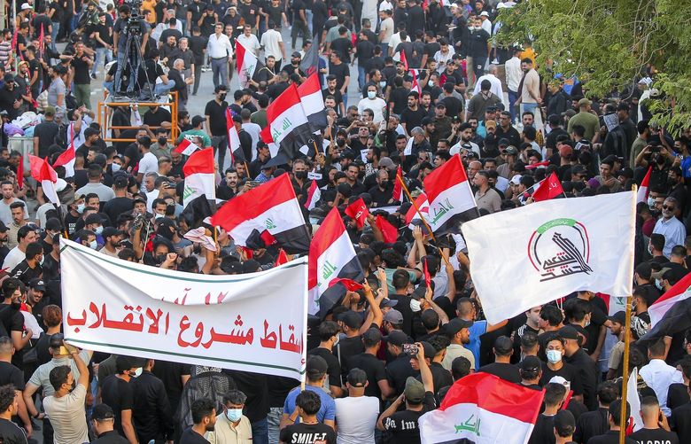 Supporters of Iran-backed Shiite Coordination Framework attend a rally to denounce their rivals, followers of an influential Shiite cleric Muqtada al-Sadr who stormed the parliament last month and have since been holding a sit-in outside the assembly building in Baghdad, Iraq, Friday, Aug. 12, 2022. (AP Photo/Anmar Khalil) DV108 DV108