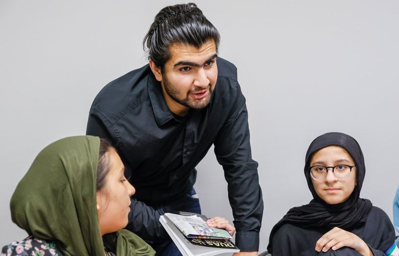 House of Wisdom – Ahmad Hilal Abid – 081522
Edmonds College student Ahmad Hilal Abid talks with students as they chat about social media during a class at the House of Wisdom Monday, Aug. 15, 2022, in Lynnwood, Wash. 221277