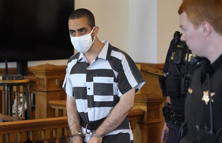 FILE – Hadi Matar, 24, center, arrives for an arraignment in the Chautauqua County Courthouse in Mayville, NY., Saturday, Aug. 13, 2022. Matar, the man charged with stabbing Salman Rushdie on a lecture stage in western New York on Friday, Aug. 12 said in an interview that he was surprised to learn the accomplished author had survived the attack. (AP Photo/Gene J. Puskar, File) NYSS320 NYSS320