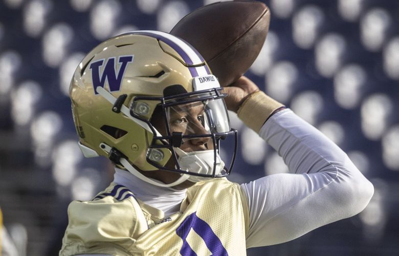 Friday, April 1, 2022.   UW quarterback Michael Penix Jr. passing during the second day of spring workouts in the stadium on campus.   219993
