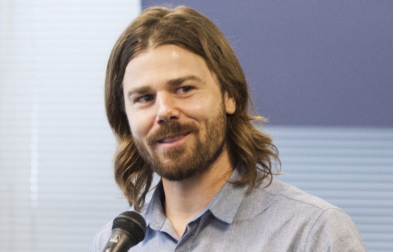 FILE – Dan Price, the chief executive of Gravity Payments, announces a plan to his employees that will raise the company’s minimum wage to $70,000 a year within two years, at offices in Seattle, April 13, 2015. Price and his brother, Lucas, co-founded the company, a fast-growing privately held credit-card payment processing company. On July 8,  2016, a judge ruled in Washington state that Lucas Price had failed to prove his claims that Dan had overpaid himself and inappropriately used a corporate credit card for personal expenses. (Matthew Ryan Williams/The New York Times)