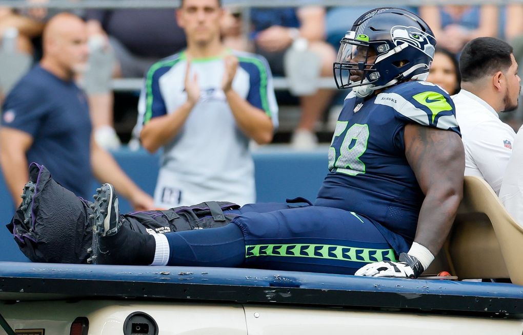 Seahawks guard Damien Lewis escapes serious injury after being carted off  field vs. Bears