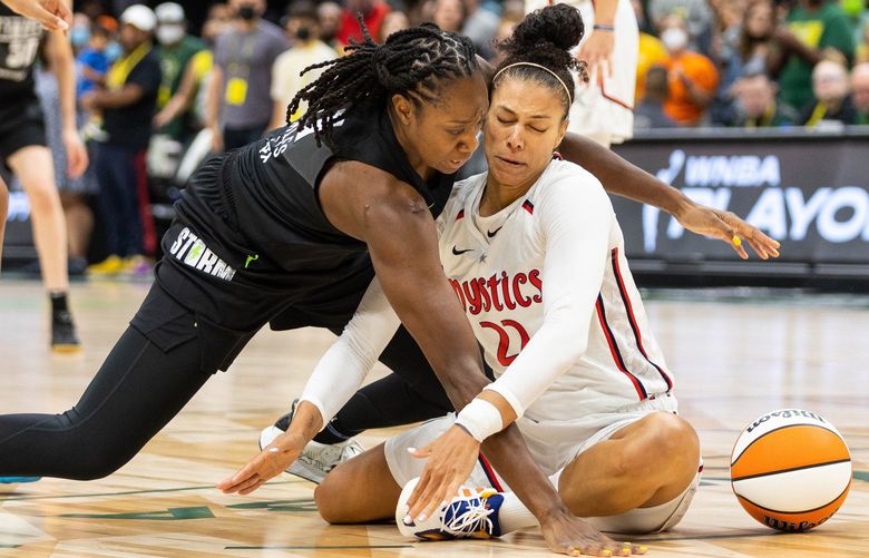 Seattle’s Tina Charles and Washington’s Alysha Clark bump heads going after the loose ball under the Storm net in the first quarter Thursday.

The Washington Mystics played the Seattle Storm in Game 1 of the first round of the WNBA Playoffs Thursday, August 18, 2022 at Climate Pledge Arena, in Seattle, WA. 221311