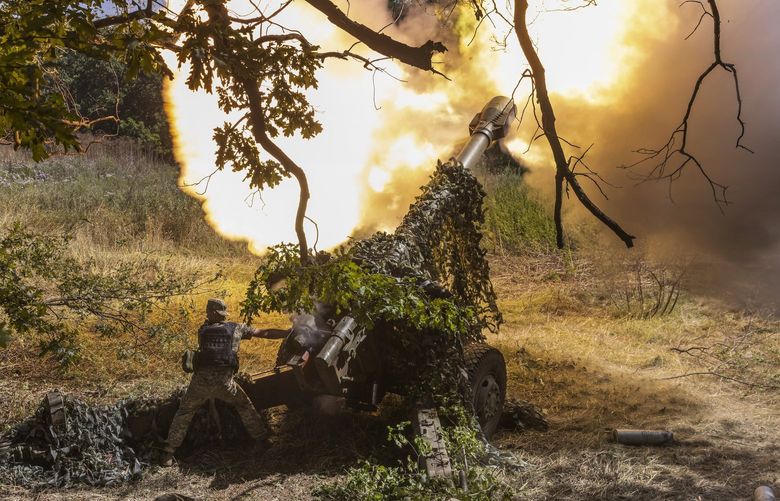 FILE — An artillery unit from Ukraine’s 58th Brigade fires toward advancing Russian infantry from a frontline position near the town of Bakhmut, Ukraine on Aug. 10, 2022. Ukraine has been able to stymie Russia thanks in large part to weapons from the U.S., the E.U. and other allies. (David Guttenfelder/The New York Times) XNYT168 XNYT168