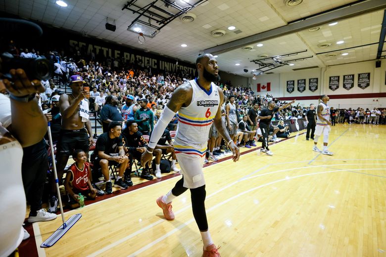 LeBron James walks across the court during the CrawsOver tournament Saturday at Seattle Pacific University. (Jennifer Buchanan / The Seattle Times)